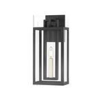Amire Exterior Wall Sconce with layered rectangular black frame and slender off-white candle encased in clear glass