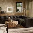 Styled in living room with window, drapes, round wooden coffee table, and modern decor