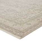 Corner close-up showing tufted texture and cream fringe edges of Valentin Oriental Rug.