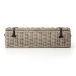 Back of trunk revealing evenly woven rattan and buckle strap anchors