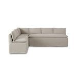 Modular L-shaped slipcover dining banquette in neutral flax linen with feather-blend cushioning and flanged seams