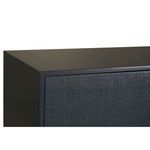 Close-up on top corner showing smooth navy wood finish and raffia textured door front