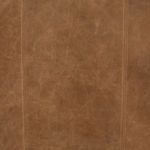 Close-up of leather surface texture with visible subtle natural markings and stitching