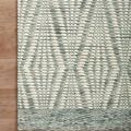 Corner of Keniz Ivory Sage Rug on wood floor showing detailed weave and contrast of ivory and sage colors