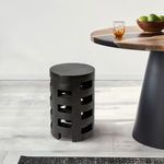 Canyon Teakwood Stool positioned next to a modern round dining table with natural wood top in a bright room