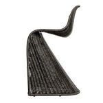 Opposite side profile with focus on sleek rattan curves and stool base silhouette