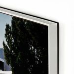 Detailed close-up of thick white frame around vibrant Slim Aarons Palm Springs pool image