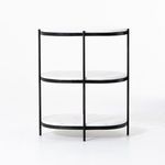 Felix Oval Nightstand styled as bedside table in room with hardwood floor and bed with grey fabric frame