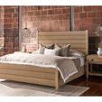 Canyon Post Bed in a styled bedroom setting with neutral bedding and exposed brick wall background