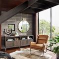 Cru Large Mirror displayed in stylish living room with brown leather chair and large windows