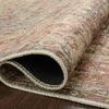 Rolled edge of Adrian Ocean / Clay Rug showing fabric thickness and stitching details on dark floor