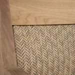 Close-up of woven natural teak panel in chair’s backrest