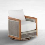 Side angle showing rounded swivel base and rope detailing on chair sides