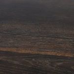 Close-up angle of oak tabletop edge showing natural wood grain and smooth finish