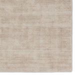 Close-up corner view showing soft variations in taupe pile and subtle sheen