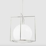 Full side view of pendant hanging straight with chrome frame around white spherical shade