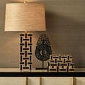 Smaller box paired with matching lamp base and ornamental sculpture in warm interior setting