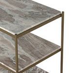 Close-up side angle showing layered marble shelves and slim antique brass iron framing