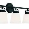 Kaden vanity light shown at a three-quarter angle from the front emphasizing the shape of white shades