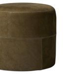 Camino Ottoman side view focusing on the patchwork leather panels and detailed stitching
