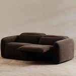Angled charcoal brown recliner sofa with seat cushion and armrest visible on right side
