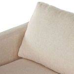 Detail of loose feather-filled back cushion on sectional seat