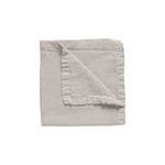 Cloud grey linen table runner folded to show soft texture and stitched borders with subtle ruffle detail