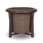 Side view of basket tilted to the right showing consistent weave and teak legs