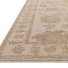 Willa Bone / Clay Rug close-up side view showing textured yarns and low pile edge detail.