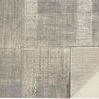 Flat lay of Aura Gray / Gold Rug showing backing and detailed abstract pattern