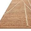 Close-up on textured weave and braided jute details along edge of the rug