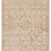 Overhead arrangement showing stacked rugs in varied traditional patterns and colors, including gold and ivory medallion rug