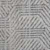 Zoomed detail of rug’s charcoal linear motifs highlighting hand-knotted wool pile.