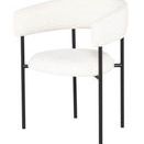 Cassia Dining Chair in buttermilk boucle fabric with high curved back and slender black metal legs