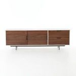 Media console front view with all doors and drawers closed, on a white background