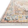 Close-up side angle showing low pile texture and multicolor border details of Clara Mist vintage style rug