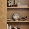 Bowl integrated on a styled wooden shelf with ceramic jars and a decorative crab sculpture