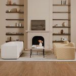 Alora sofa in living room scene paired with patterned sectional and minimalist fireplace.