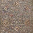 rectangular rug with a muted blue background featuring classic floral motifs in cream, rust, and gold colors