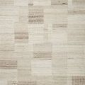 Natural-toned Manfred rug with a patchwork of high-low wool textures in beige and cream shades