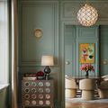 Polyhedron Pendant hanging in green paneled room above dining table with chairs and artwork