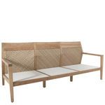Rear angled view emphasizing woven rattan backs on each section of the three-seat sofa.