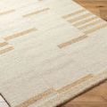 Close-up angled view of Max rug showing plush medium pile and part of wooden floor