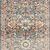 Narrow runner-style version of the rug with the same navy and rust traditional pattern