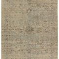 Tilda hand-knotted area rug in green and tan with a faded floral pattern and decorative border, 9 by 12 feet