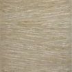 Wade Sage Gold solid color rug with abstract linear motifs and saturated earth tones, fringed edges