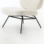 Close-up of plush ivory angora fabric on cushioned backrest of Caleb Small Accent Chair