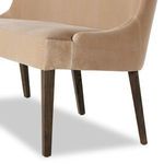 Close-up focusing on tailored upholstery fit over the curved armrest area