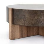 Top detail showing iron surface mottled with dark streaks and wood rim pegs