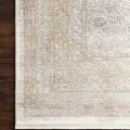 Corner view of Gemma Sand Ivory Rug on dark hardwood floor showing texture and edging detail